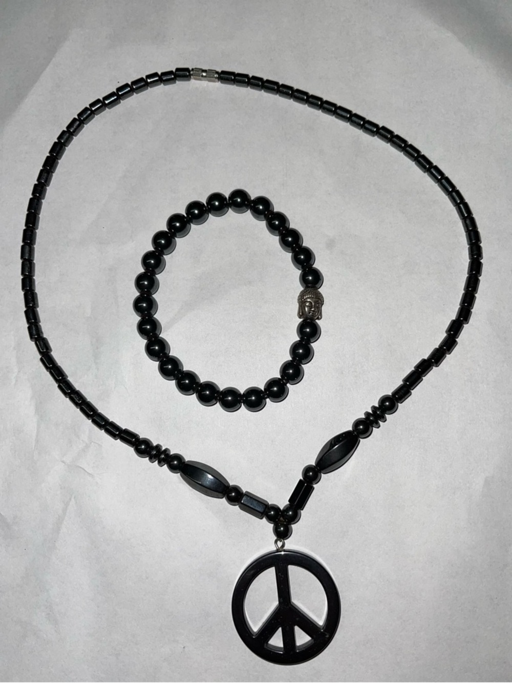 Hematite Buddha chakra hand bracelet with peace necklace